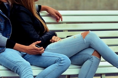 teenagers sitting on bench